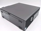 a close up of a black computer on a white surface