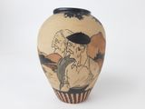 a vase with a picture of a man and a woman on it