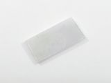 a small piece of plastic on a white surface