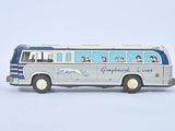 a toy bus that has people on the side of it