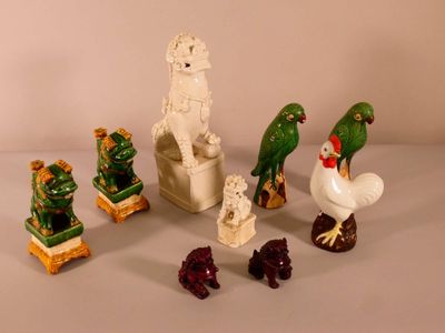 many figurines of animals and birds on the table