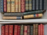 many books that are on the shelves in the room