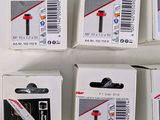 boxes of assorted batteries on a white surface with labels on them