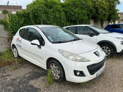 two small cars parked next to each other in a parking lot