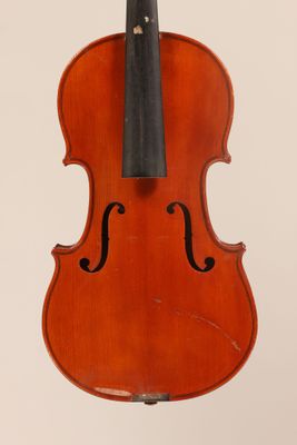 an old violin with a bow hanging from it ' s back