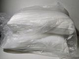 a bag of white pillows sitting on a table
