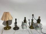 three lamps are sitting next to each other on a table