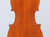 an old violin with a wooden back and bow on a white background
