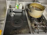 a pot that is sitting on the stove in the kitchen