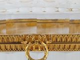 a clear glass box with a gold ring on it