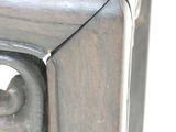 a close up of a wooden table with a metal frame