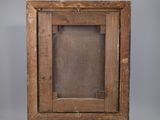an old picture frame with a wooden base and a wooden stand