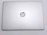 a white laptop with a hp logo on it