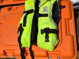 an orange case with a life jacket on top of it