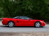 a red sports car parked on the side of the road