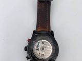 a close up of a watch on a white surface with a white background