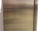 a stainless steel refrigerator with a red light on top of it