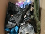 a cardboard box filled with assorted items and a cactus