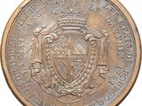 an old coin with a coat of arms and a crown on it