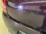 a close up of a car with a sticker on it