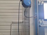 an image of a garage with a tv mounted to the side of the wall