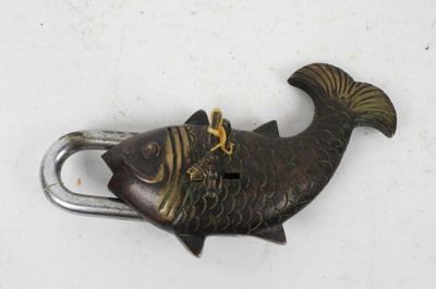 a fish that is attached to a hook on the wall
