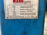 an image of a blue machine sitting on top of a cement floor