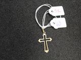a cross on a string with tags attached to it