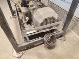 a machine that is sitting on the ground in the garage