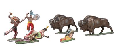 four figurines of different types of animals on a white background