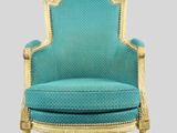 an image of a blue chair with a gold frame and blue upholstered seat