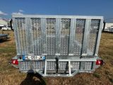 an image of a trailer that is parked in the grass