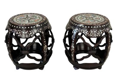pair of black and white ceramic stools with floral designs