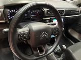 the interior of a car with a steering wheel and dashboard controls