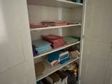 a closet with a lot of boxes and boxes on it