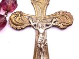 rosary with a crucifix on a chain with a purple bead