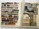 a book with stamps on the pages and a box with stamps on the pages
