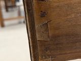 a close up of a wooden chair in a room