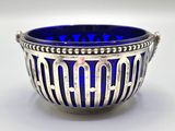 silver and blue glass bowl with the word papa written on it