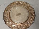 a silver plate that is sitting on a table