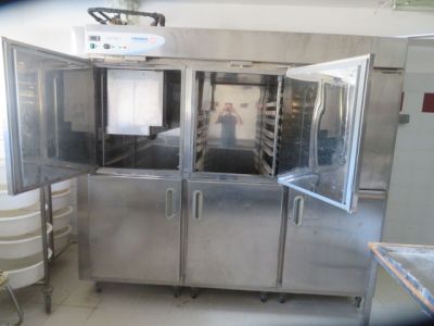 a picture of a kitchen with a lot of stainless steel cabinets
