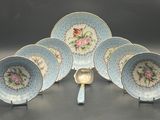 a group of blue and white plates with flowers on them