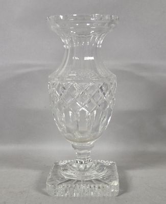 a glass vase that is sitting on top of a table