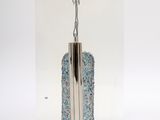 a picture of a silver and blue purse on display