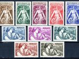 a close up of a group of stamps on a wooden surface