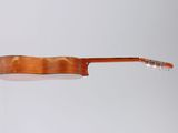 a close up of a guitar on a white surface with a white background