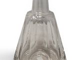 a clear glass vase that is sitting on a white surface
