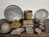 a table that has a lot of silver items on it