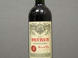 a bottle of red wine sitting on top of a table