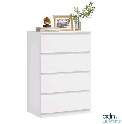 la commode est blanche et il y a une plante dessus